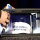 A worker rubs down a display box with a Make America Great Again hat at Trump Election Night headquarters (Photo by Jessica Rinaldi/The Boston Globe via Getty Images)